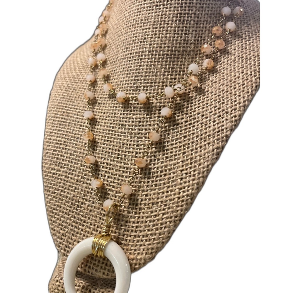 Elegant Gold and Cream Beaded Necklace with Crescent Ivory Pendant